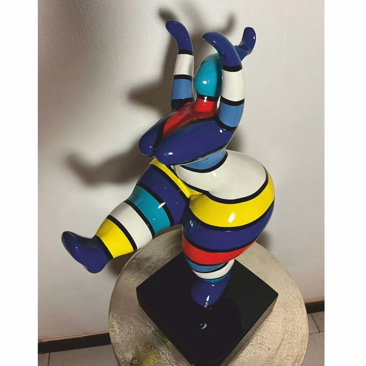 Decorative figure woman doing sports colorful with stripes H. 48 cm - exhibition piece